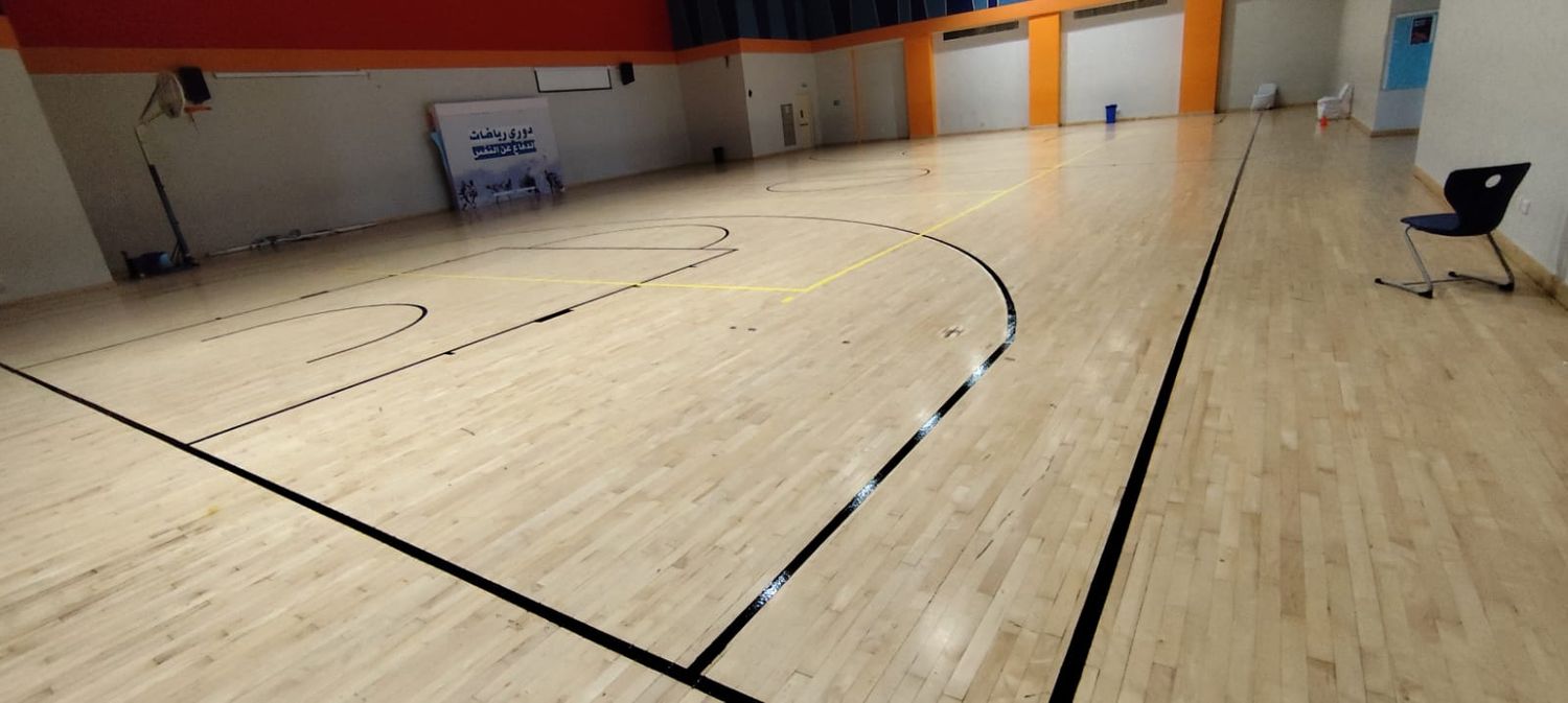 Maple wooden sports hall floor with multi-sport line marking