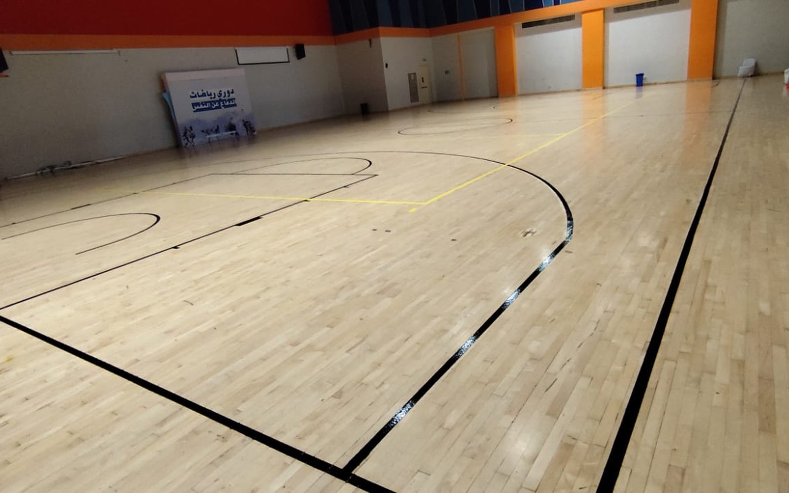 Indoor wooden sports hall flooring with multi-sport line markings