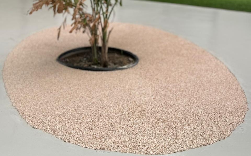 Resin-bound stone surfacing laid as a seamless circular tree surround